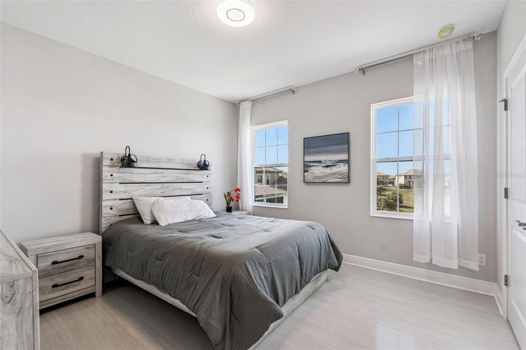 10863 Rustic Timber Loop San Antonio, FL 33576 - Photo 28 of 56 a bedroom with a bed and a window