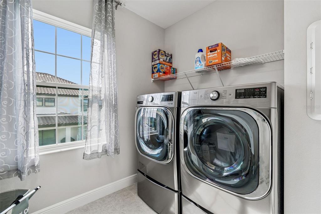 10863 Rustic Timber Loop San Antonio, FL 33576 - Photo 30 of 56 a utility room with dryer and washer
