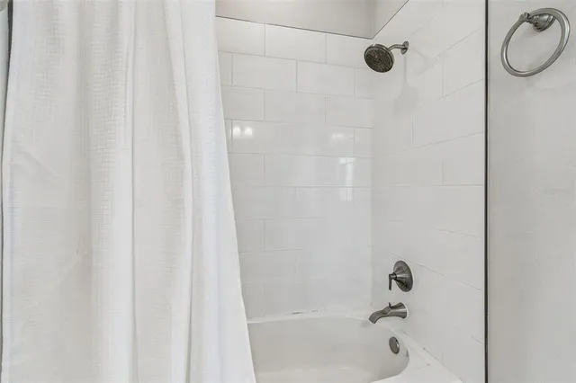 a view of utility room and bathroom