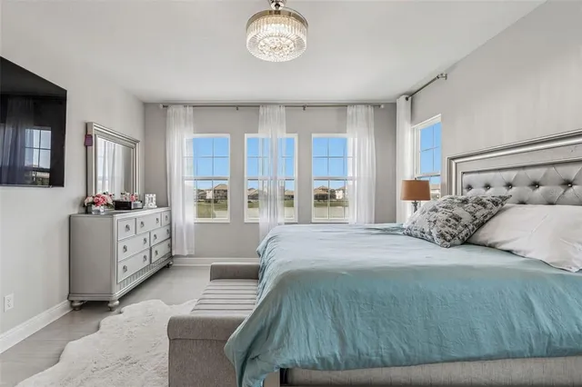 a spacious bathroom with a double vanity sink a mirror and a shower