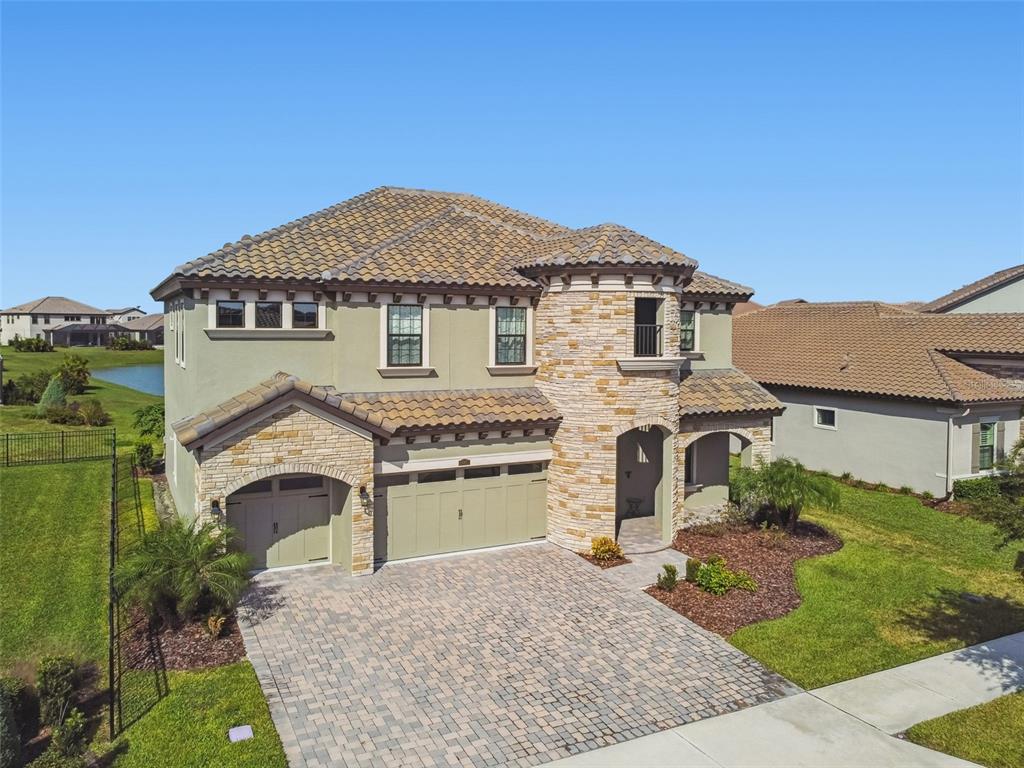 10863 Rustic Timber Loop San Antonio, FL 33576 - Photo 47 of 56 a front view of a house with a yard