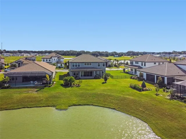 a view of a balcony with chairs and wooden floor