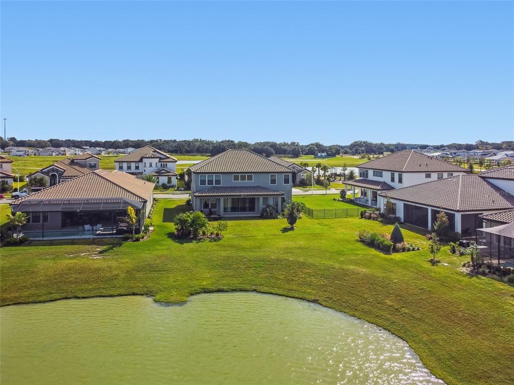 10863 Rustic Timber Loop San Antonio, FL 33576 - Photo 48 of 56 a swimming pool with outdoor seating and yard