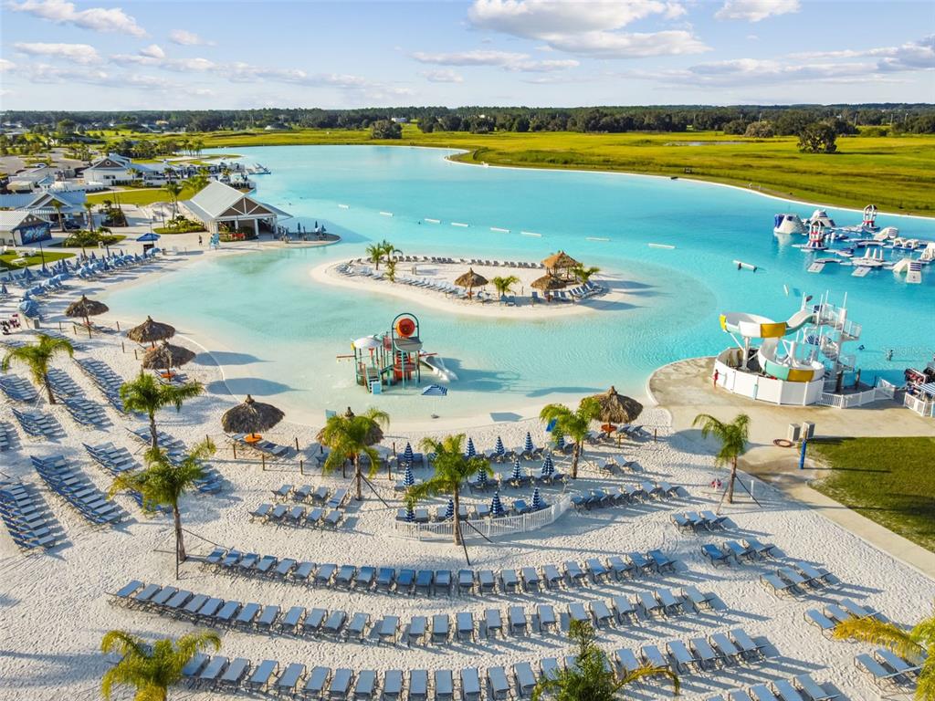 10863 Rustic Timber Loop San Antonio, FL 33576 - Photo 8 of 56 a view of a swimming pool and lake
