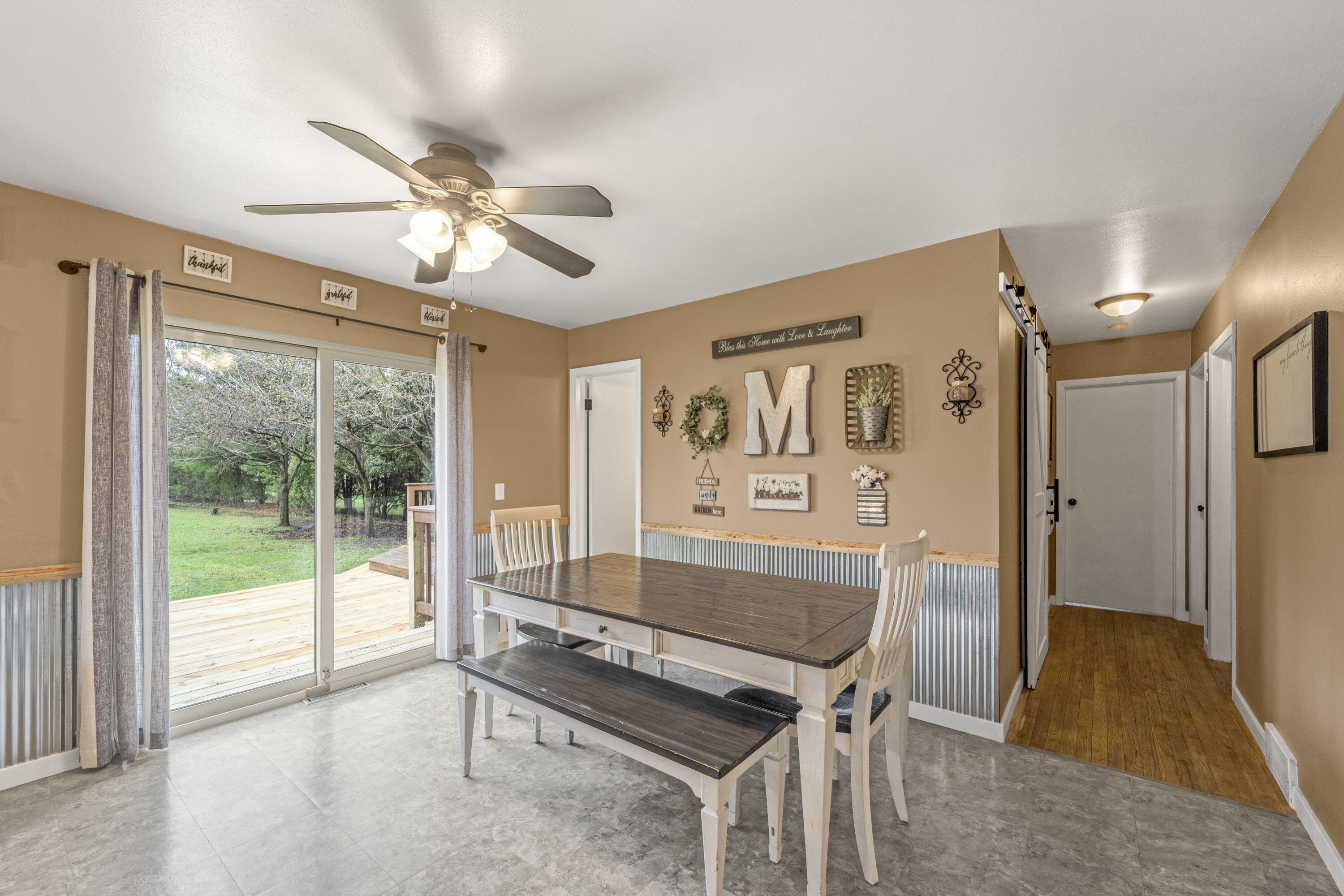 827 South Fancher Road Mount Pleasant, WI 53406 - Photo 11 of 26 Bright dining space with sliding glass doors offering easy access to deck and backyard.