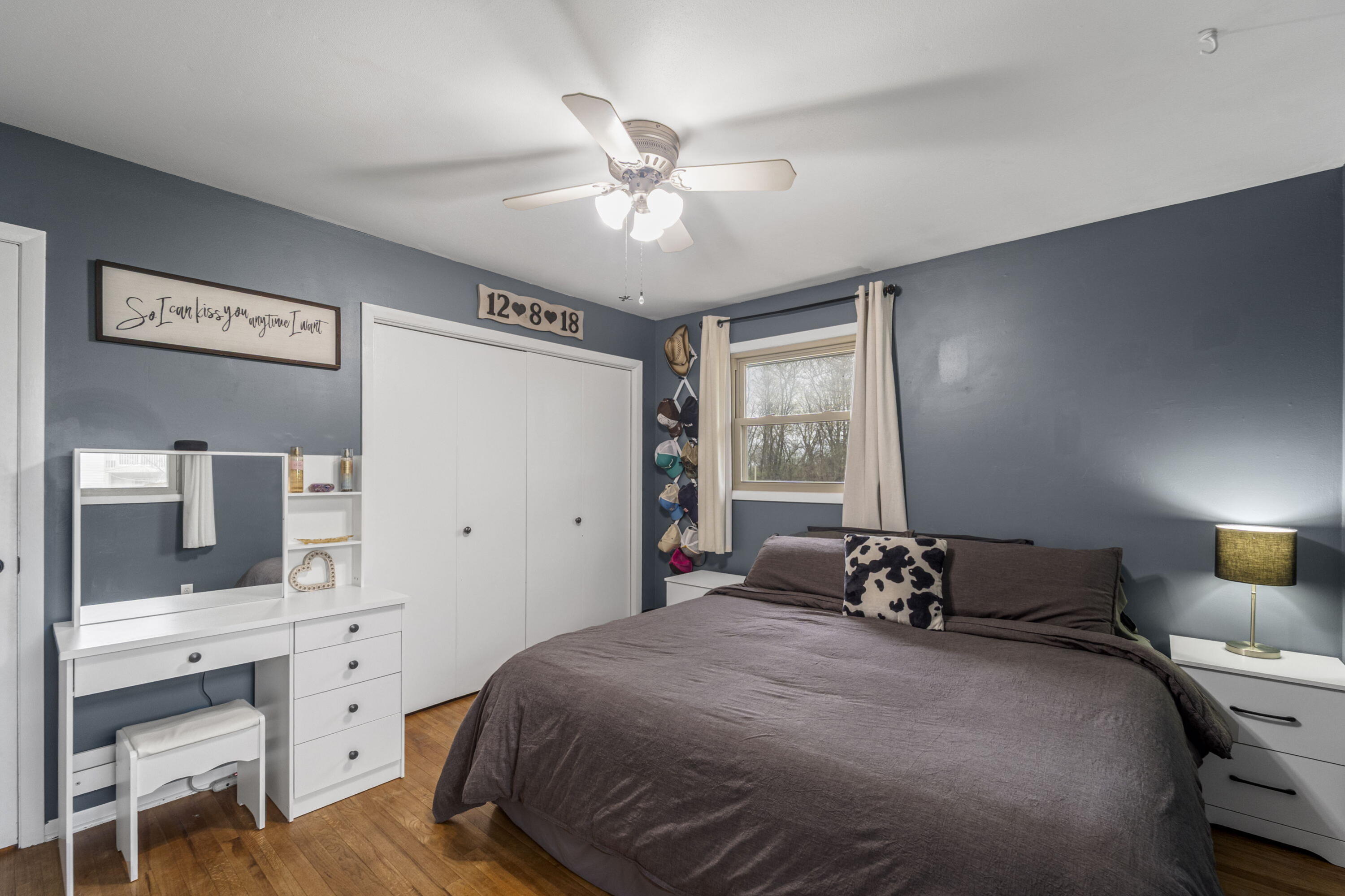 827 South Fancher Road Mount Pleasant, WI 53406 - Photo 12 of 26 Primary bedroom with hardwood floors, double closet, and plenty of space for full furnishings.