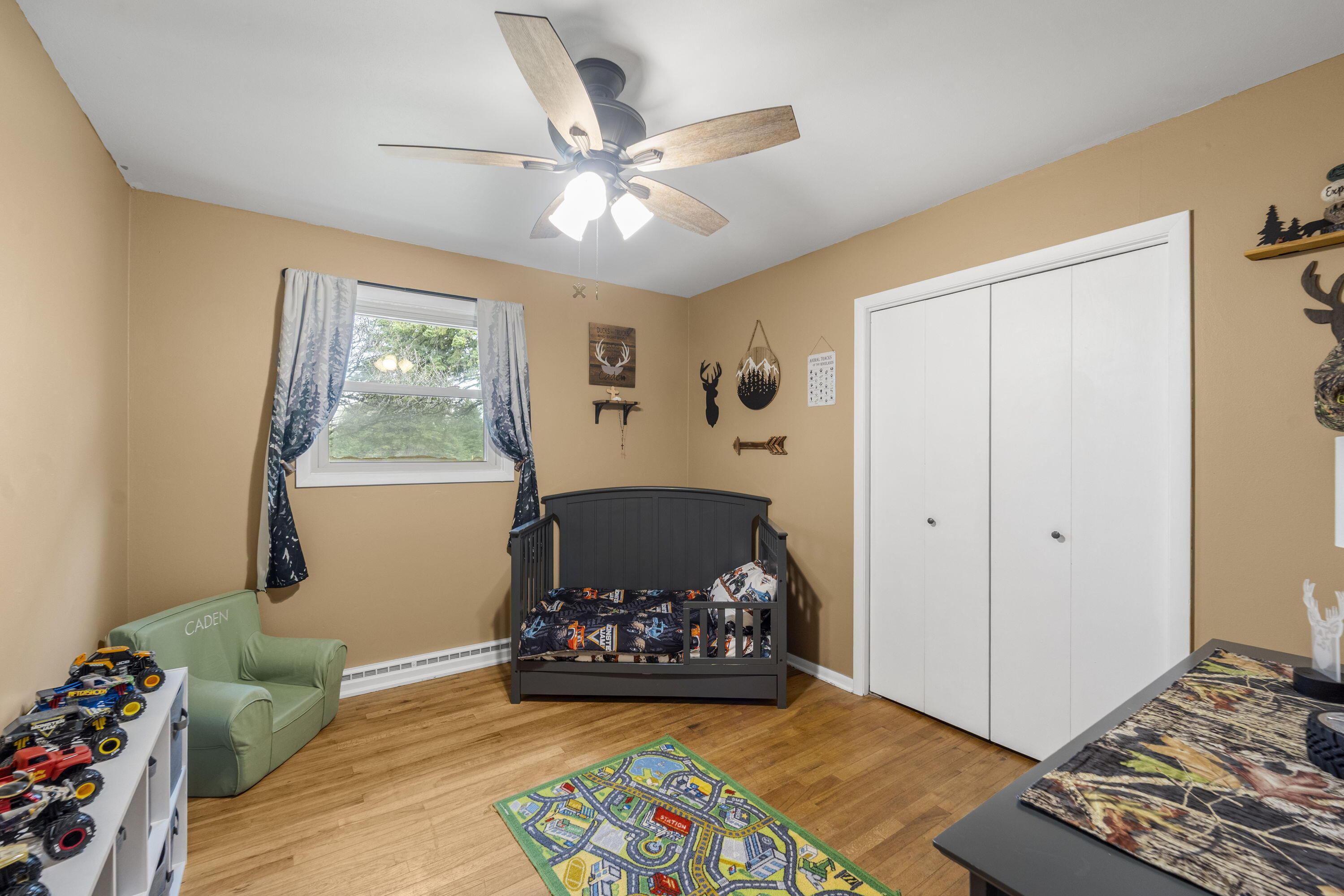827 South Fancher Road Mount Pleasant, WI 53406 - Photo 13 of 26 Bright bedroom with hardwood flooring and flexibility for guest room.