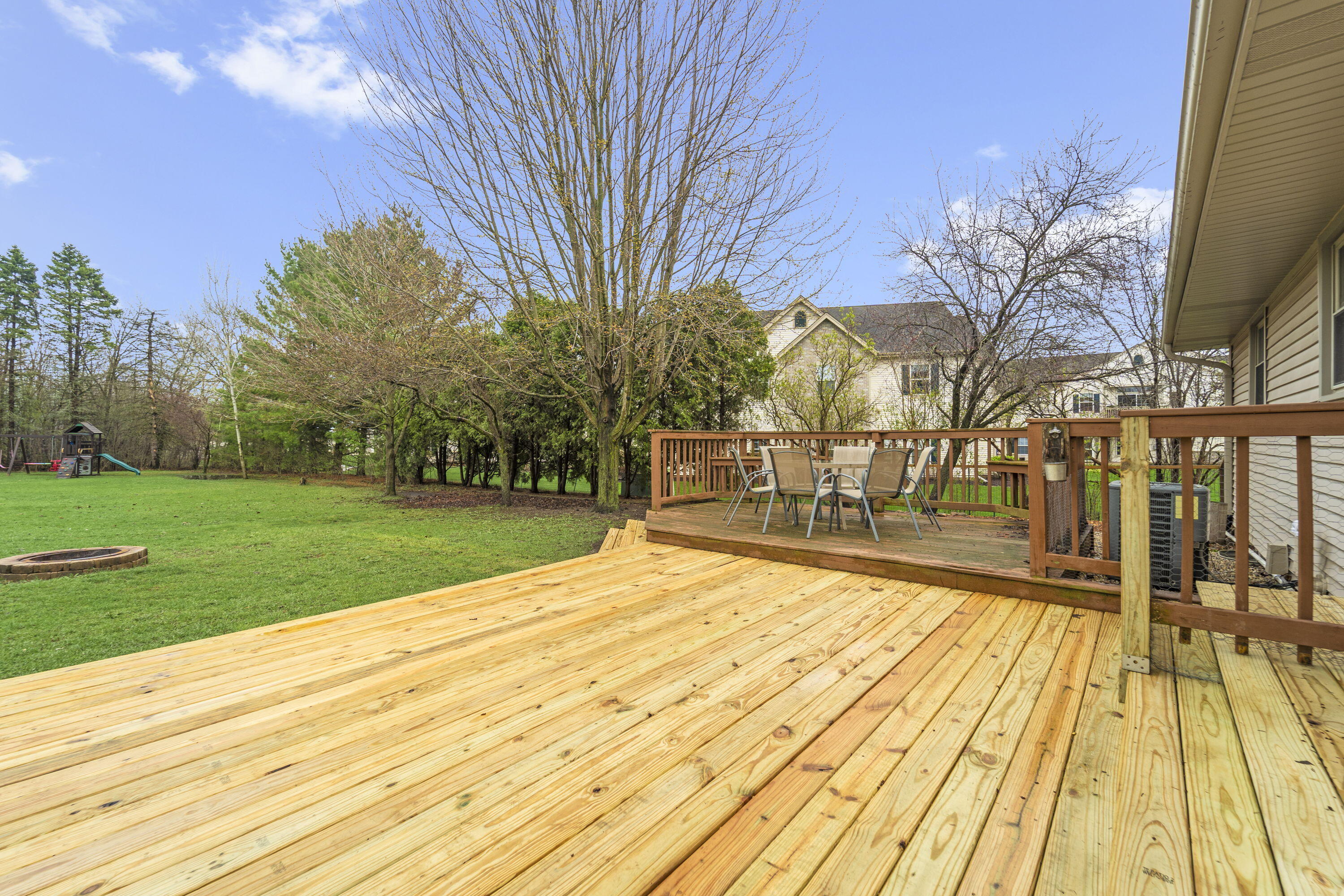 827 South Fancher Road Mount Pleasant, WI 53406 - Photo 20 of 26 Large deck offers great space for outdoor dining, entertaining, and relaxing.