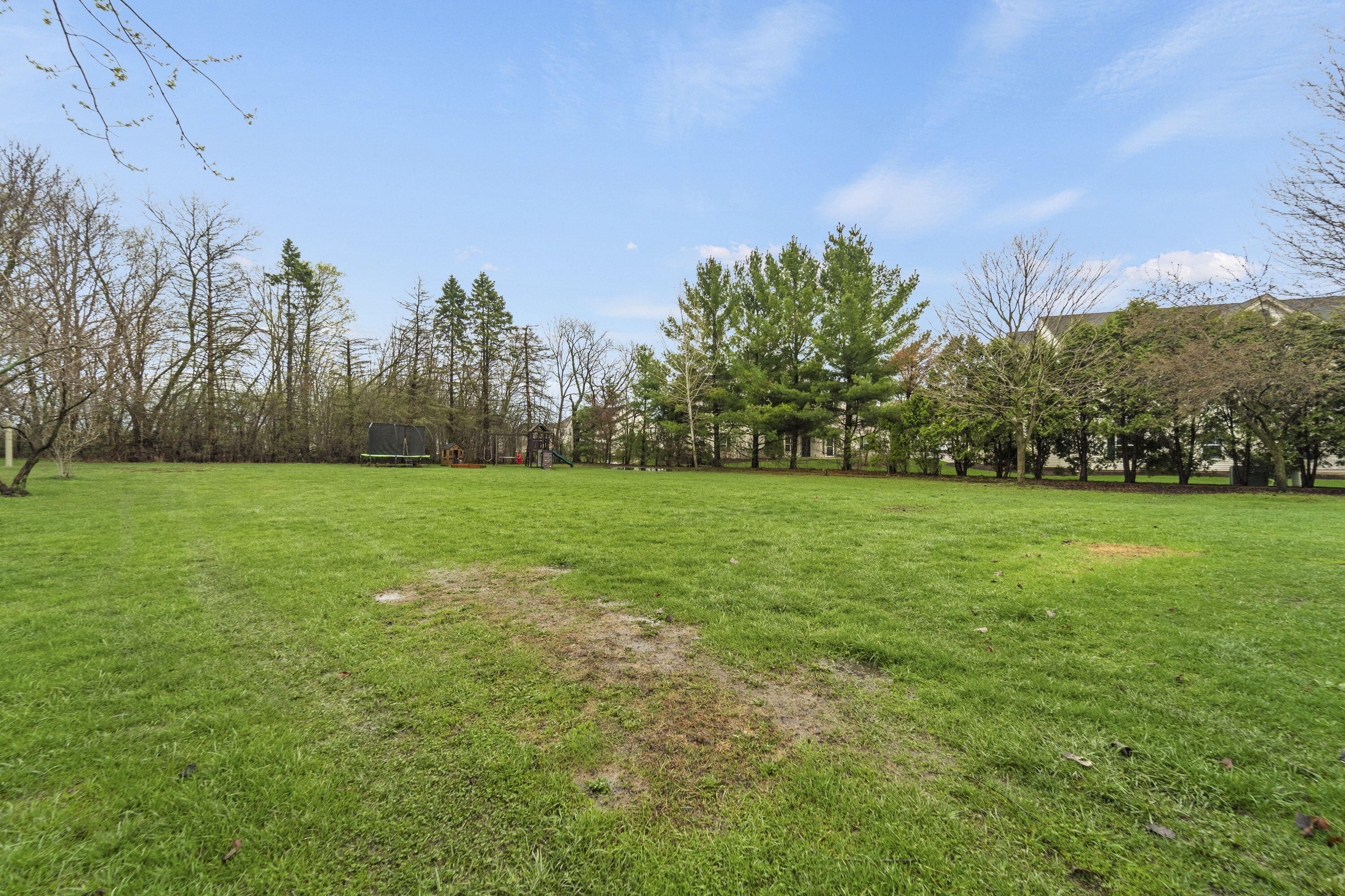 827 South Fancher Road Mount Pleasant, WI 53406 - Photo 25 of 26 Large open backyard with plenty of space for recreation, play, or entertaining.