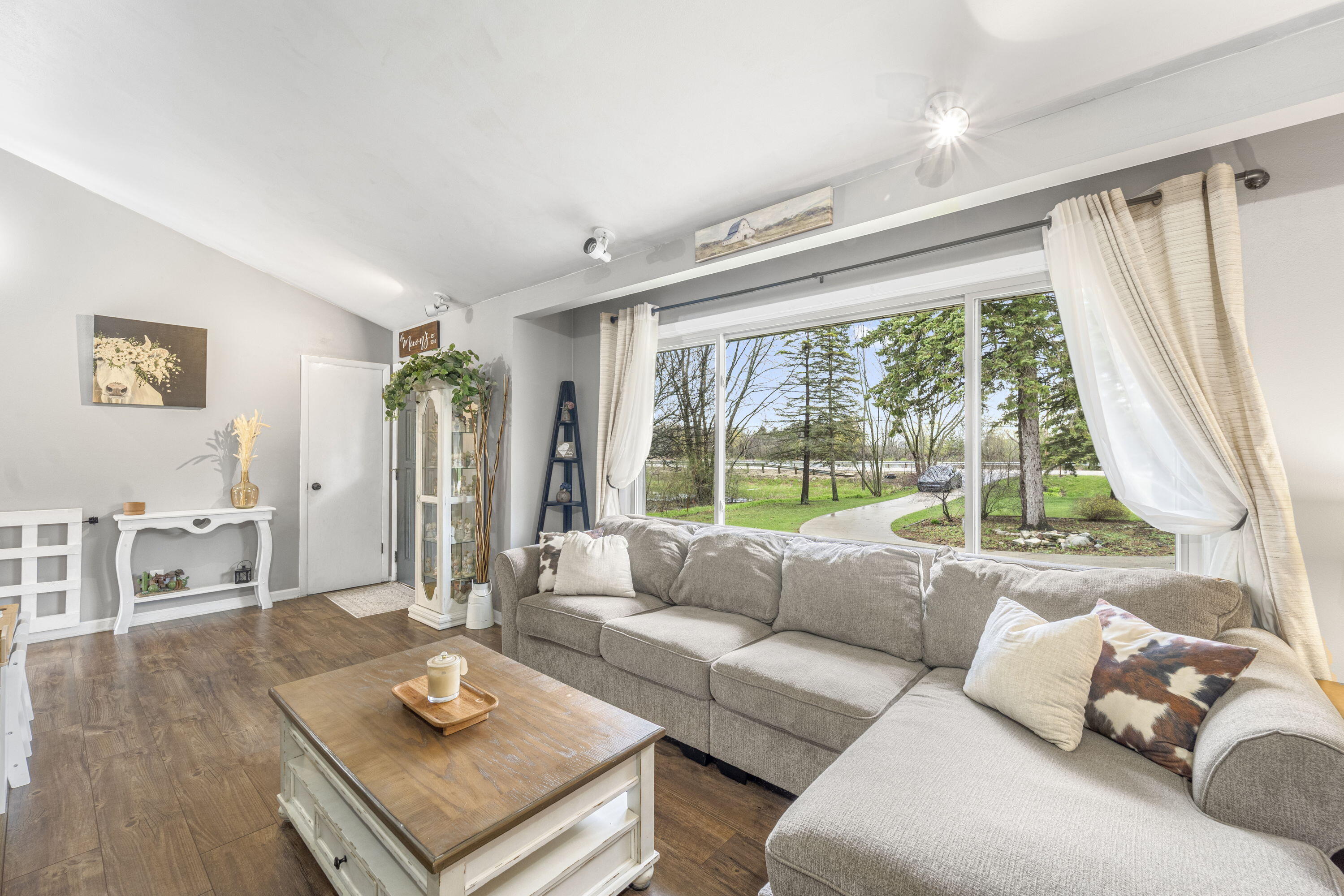 827 South Fancher Road Mount Pleasant, WI 53406 - Photo 5 of 26 Oversized window brings in natural light and offers peaceful views of the front yard.