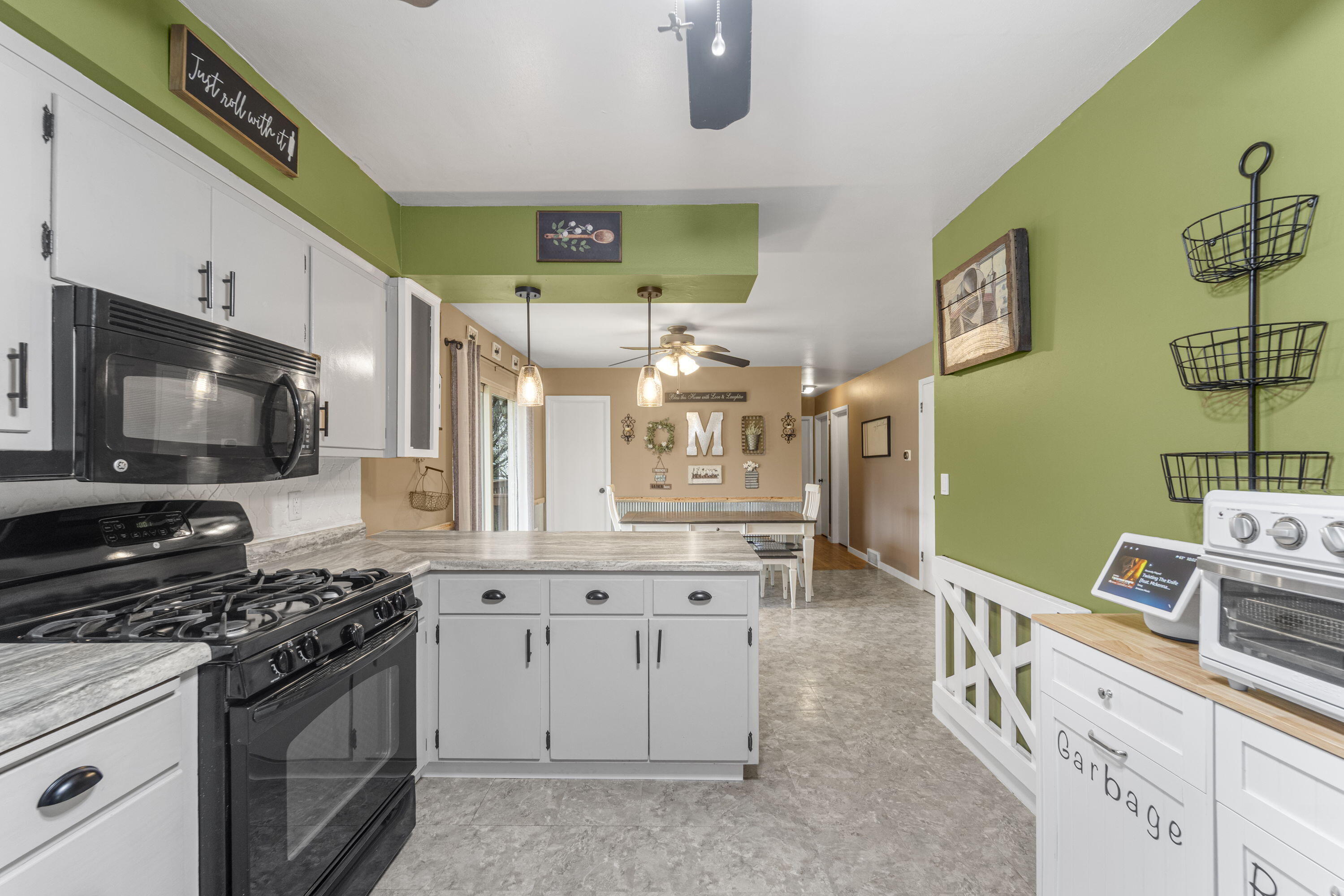 827 South Fancher Road Mount Pleasant, WI 53406 - Photo 10 of 26 Spacious kitchen with great counter space, modern appliances, and open sightlines.