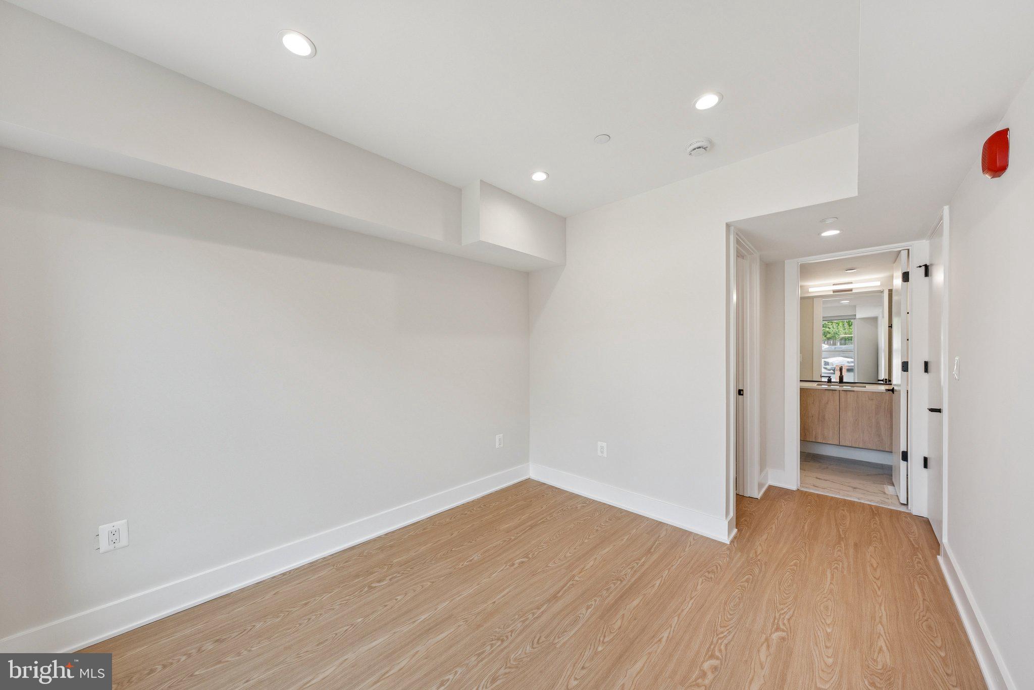 2134 Wisconsin Avenue Northwest, Unit 4 Washington, DC 20007 - Photo 12 of 32 a view of a hallway with wooden floor
