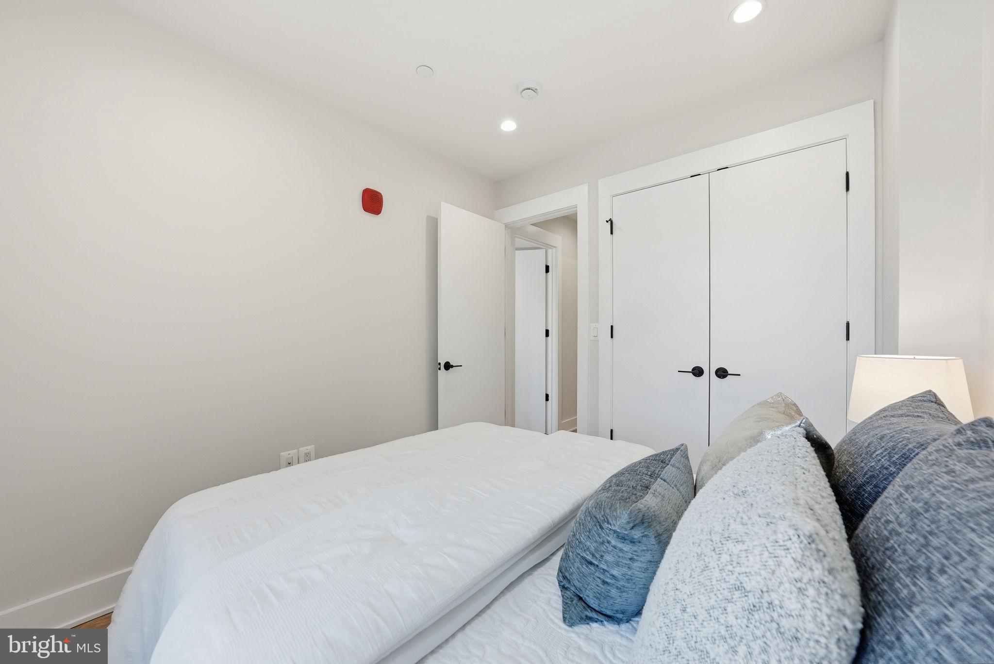 2134 Wisconsin Avenue Northwest, Unit 4 Washington, DC 20007 - Photo 14 of 35 a bedroom with a bed and a window