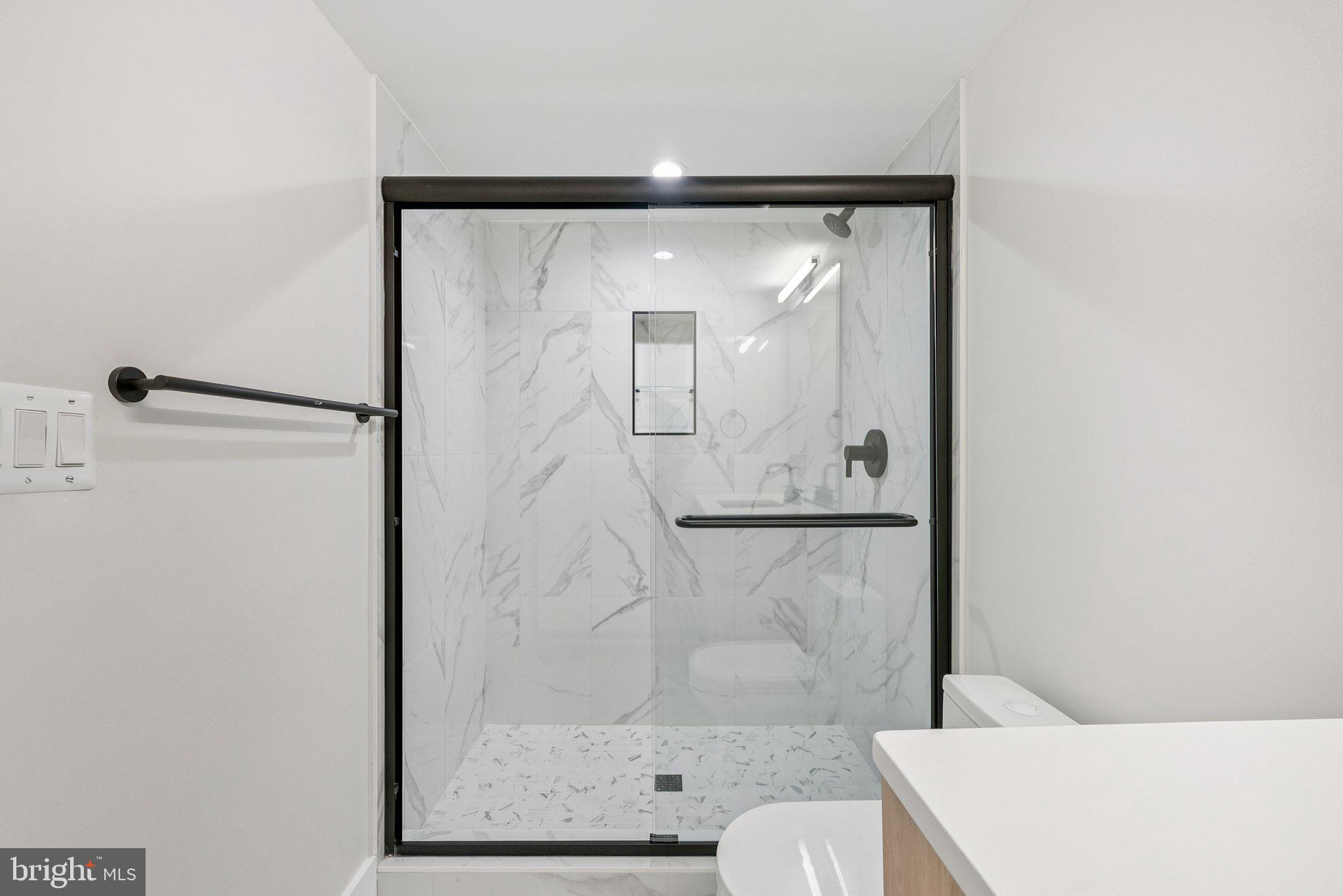 2134 Wisconsin Avenue Northwest, Unit 4 Washington, DC 20007 - Photo 16 of 32 a bathroom with a shower and toilet