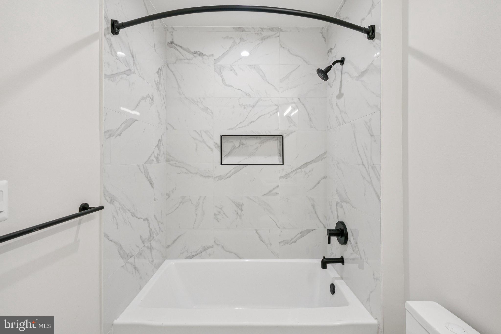 2134 Wisconsin Avenue Northwest, Unit 4 Washington, DC 20007 - Photo 18 of 32 a bathroom with a bathtub