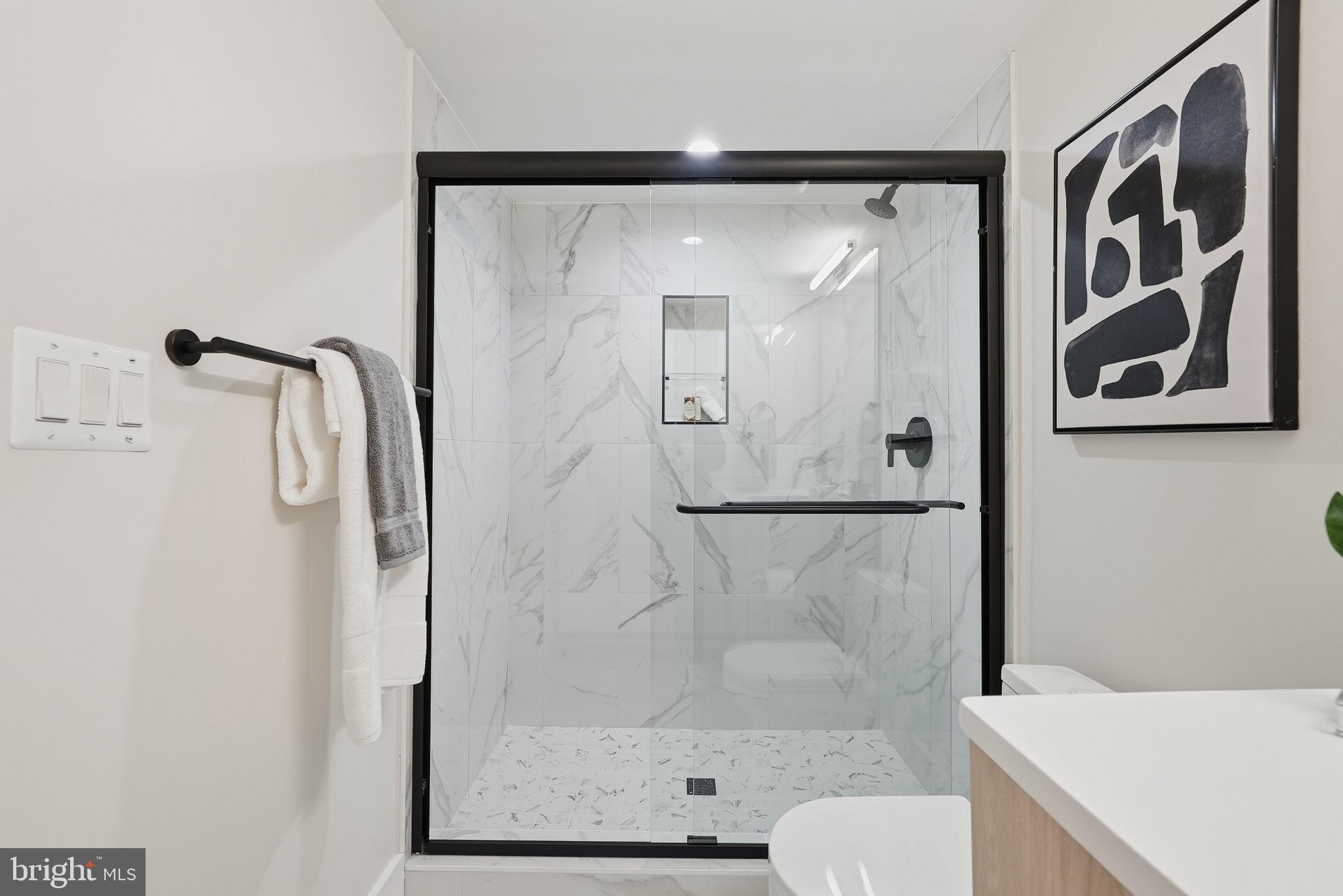 2134 Wisconsin Avenue Northwest, Unit 4 Washington, DC 20007 - Photo 21 of 35 a bathroom with a shower and toilet