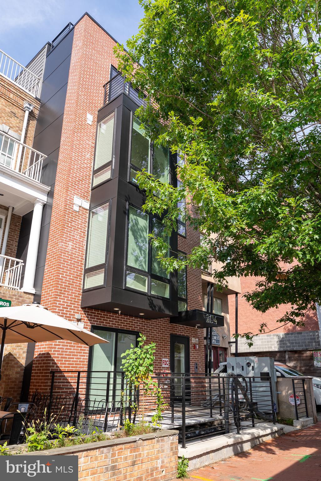 2134 Wisconsin Avenue Northwest, Unit 4 Washington, DC 20007 - Photo 28 of 32 a front view of a building with tree s