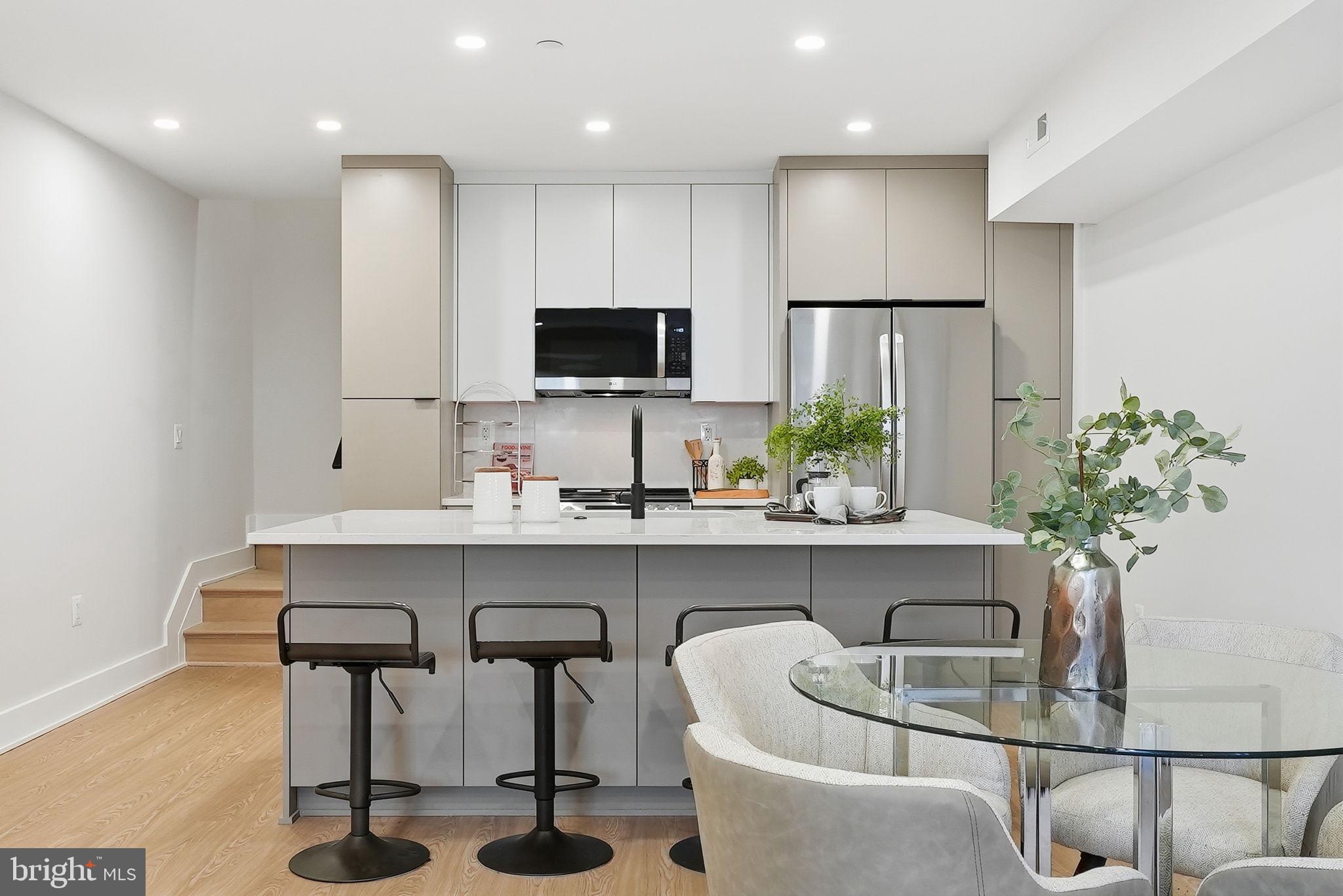 2134 Wisconsin Avenue Northwest, Unit 4 Washington, DC 20007 - Photo 3 of 35 a kitchen with a table and chairs in it