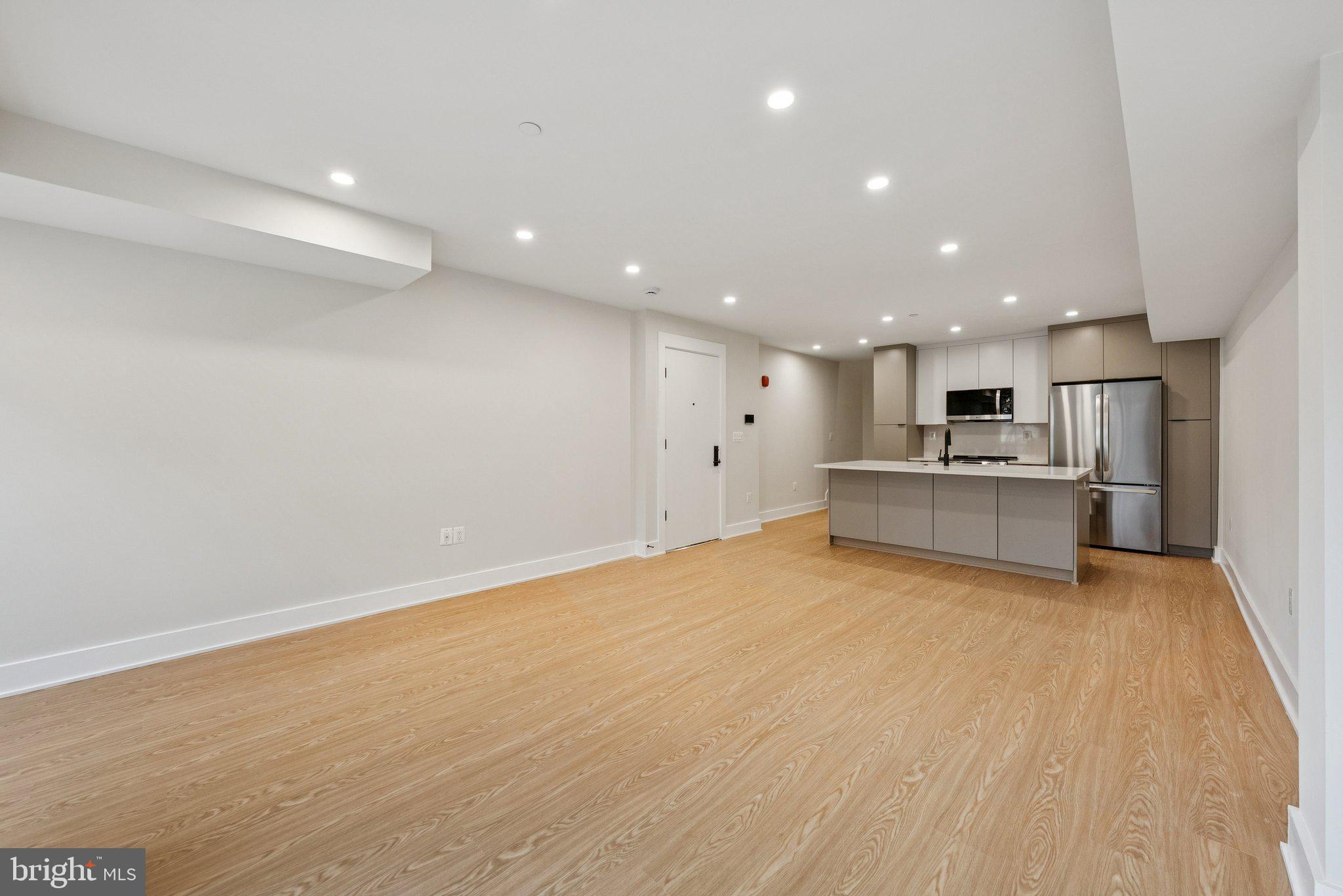 2134 Wisconsin Avenue Northwest, Unit 4 Washington, DC 20007 - Photo 8 of 32 a view of a kitchen with a sink and a refrigerator