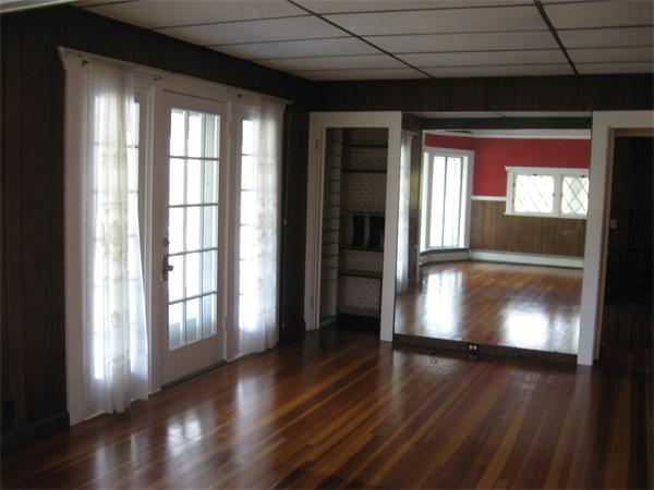 25 Starknaught Heights Gloucester, MA 01930 - Photo 6 of 10 a view of empty room with wooden floor and fan