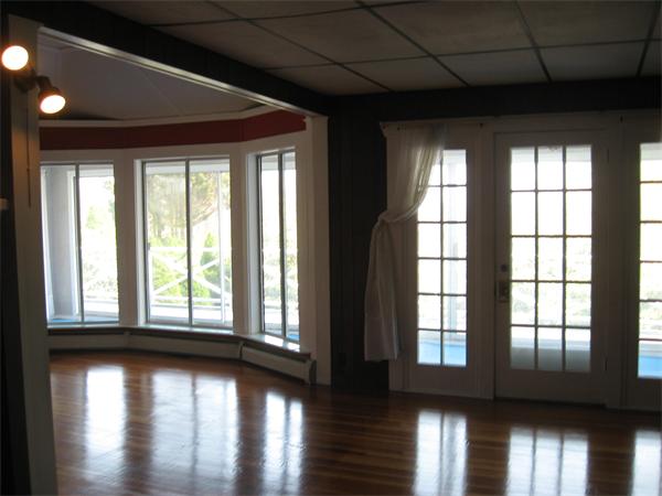 25 Starknaught Heights Gloucester, MA 01930 - Photo 7 of 10 a view of an empty room with wooden floor and a window