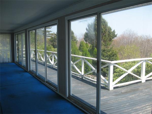 25 Starknaught Heights Gloucester, MA 01930 - Photo 9 of 10 a view of a balcony with wooden floor and fence