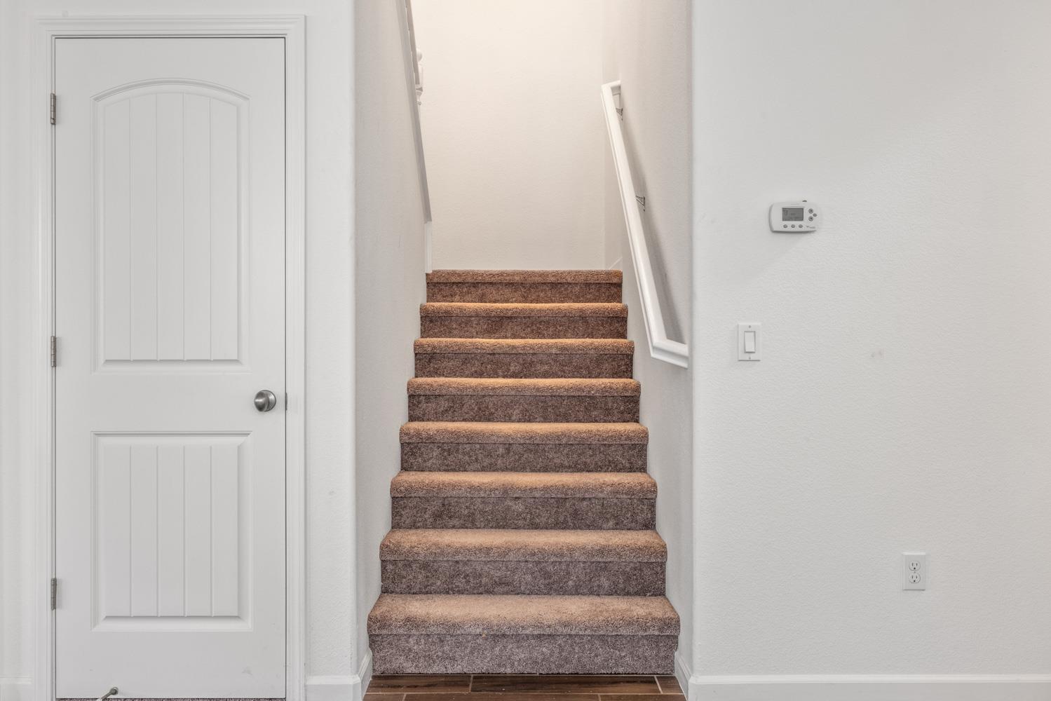 1513 Rock Spring Avenue Manteca, CA 95337 - Photo 21 of 56 a view of staircase with white walls