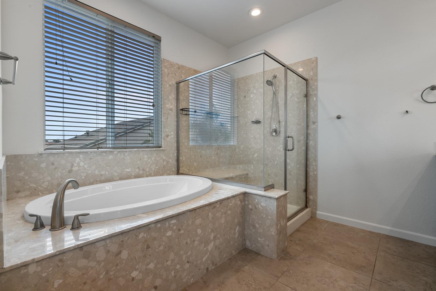 1513 Rock Spring Avenue Manteca, CA 95337 - Photo 31 of 56 a bathroom with a bathtub and a shower