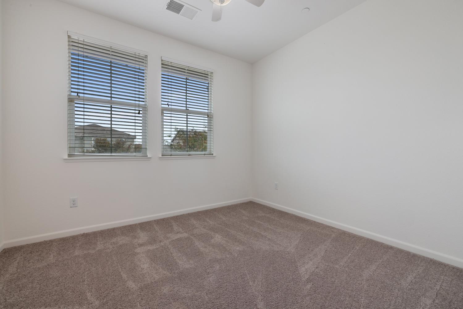 1513 Rock Spring Avenue Manteca, CA 95337 - Photo 34 of 56 an empty room with a window