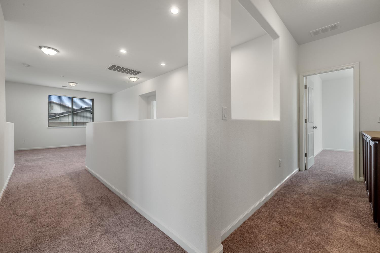 1513 Rock Spring Avenue Manteca, CA 95337 - Photo 38 of 56 a view of hallway with windows