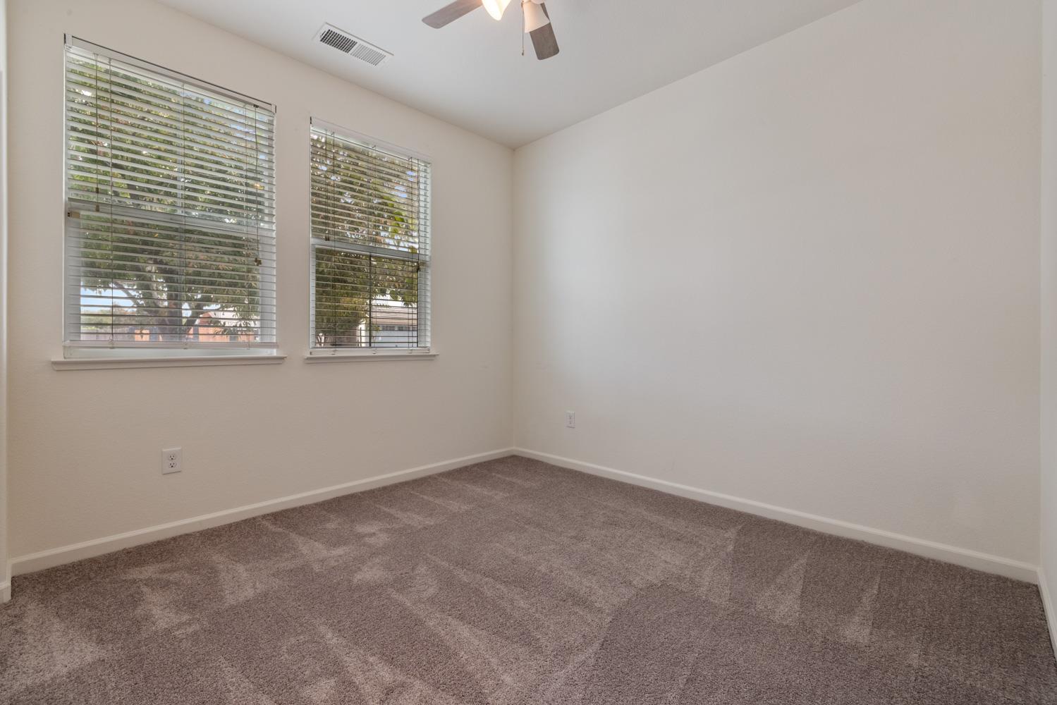 1513 Rock Spring Avenue Manteca, CA 95337 - Photo 10 of 56 an empty room with a window