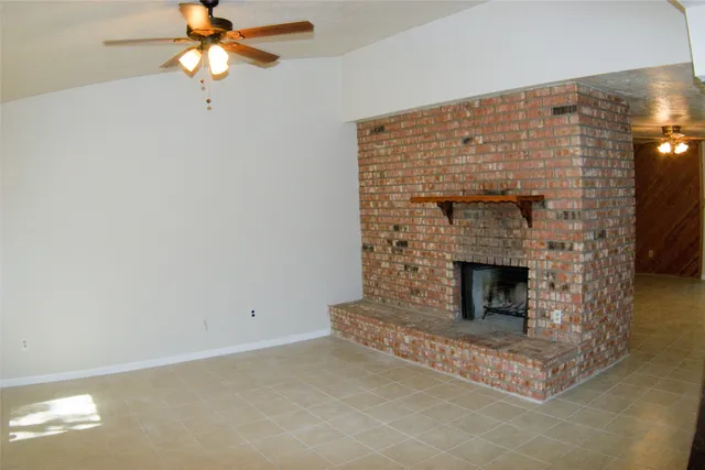 a living room with a fireplace