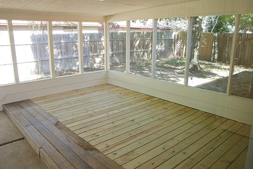 24122 Rafter 3 Drive Hockley, TX 77447 - Photo 15 of 18 a view of empty room with wooden floor and floor to ceiling window