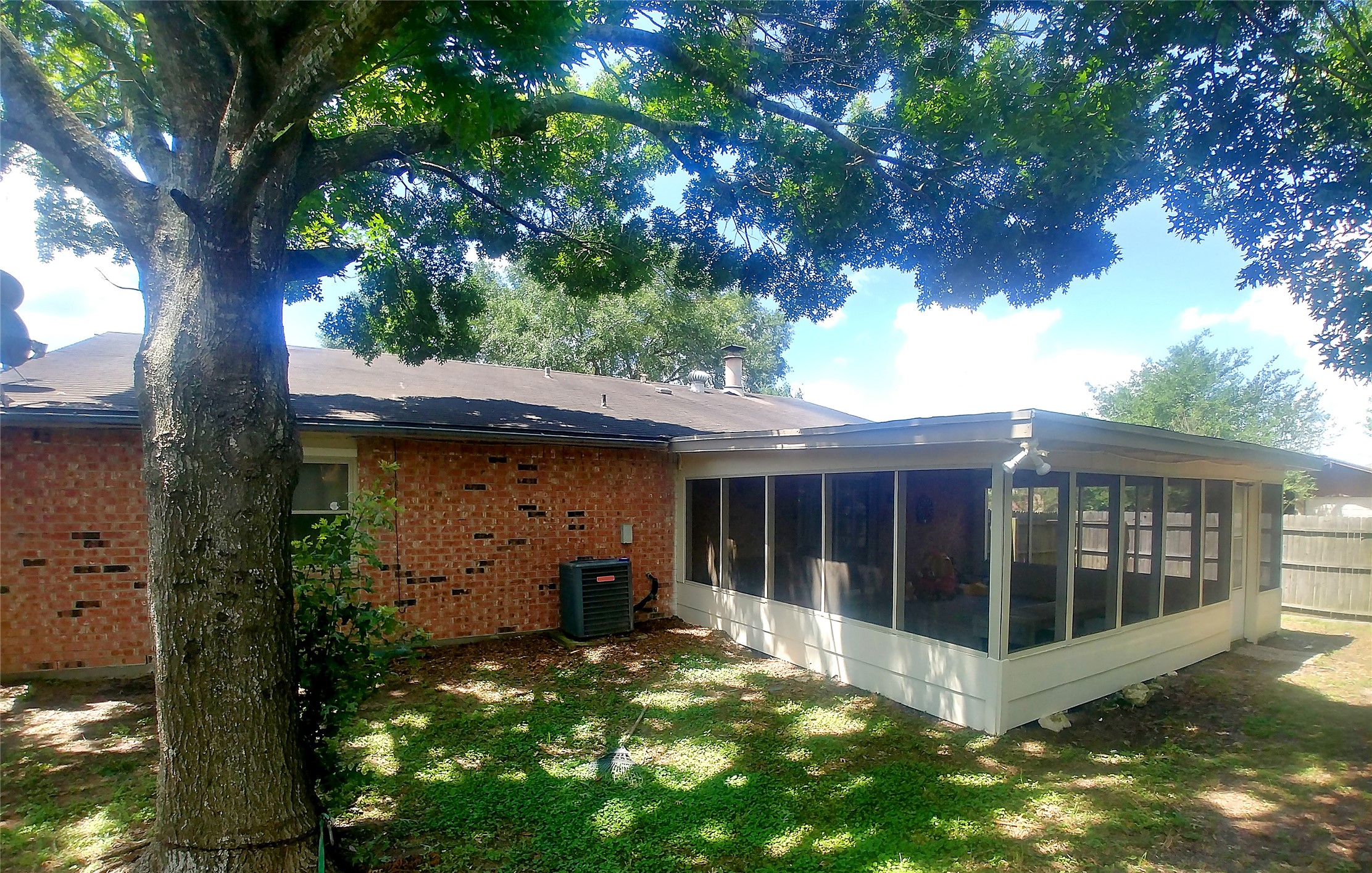 24122 Rafter 3 Drive Hockley, TX 77447 - Photo 5 of 18 a view of a house with a small yard and a large tree