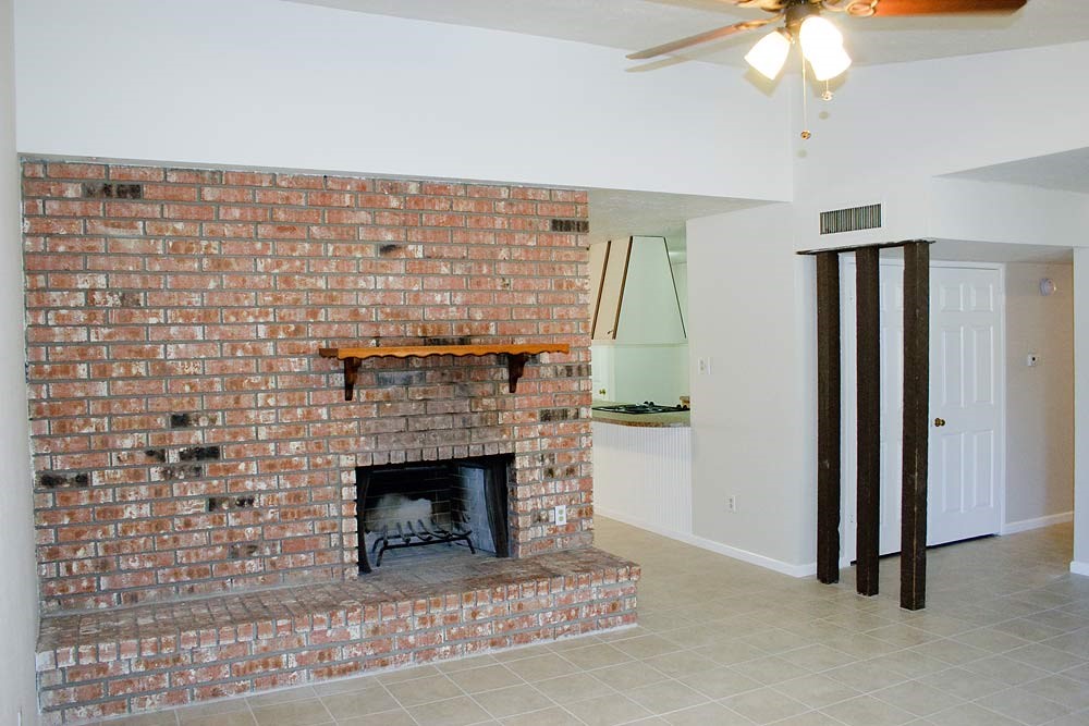 24122 Rafter 3 Drive Hockley, TX 77447 - Photo 6 of 18 a living room with a fireplace in it