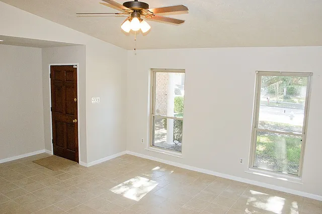 a view of an empty room with a window