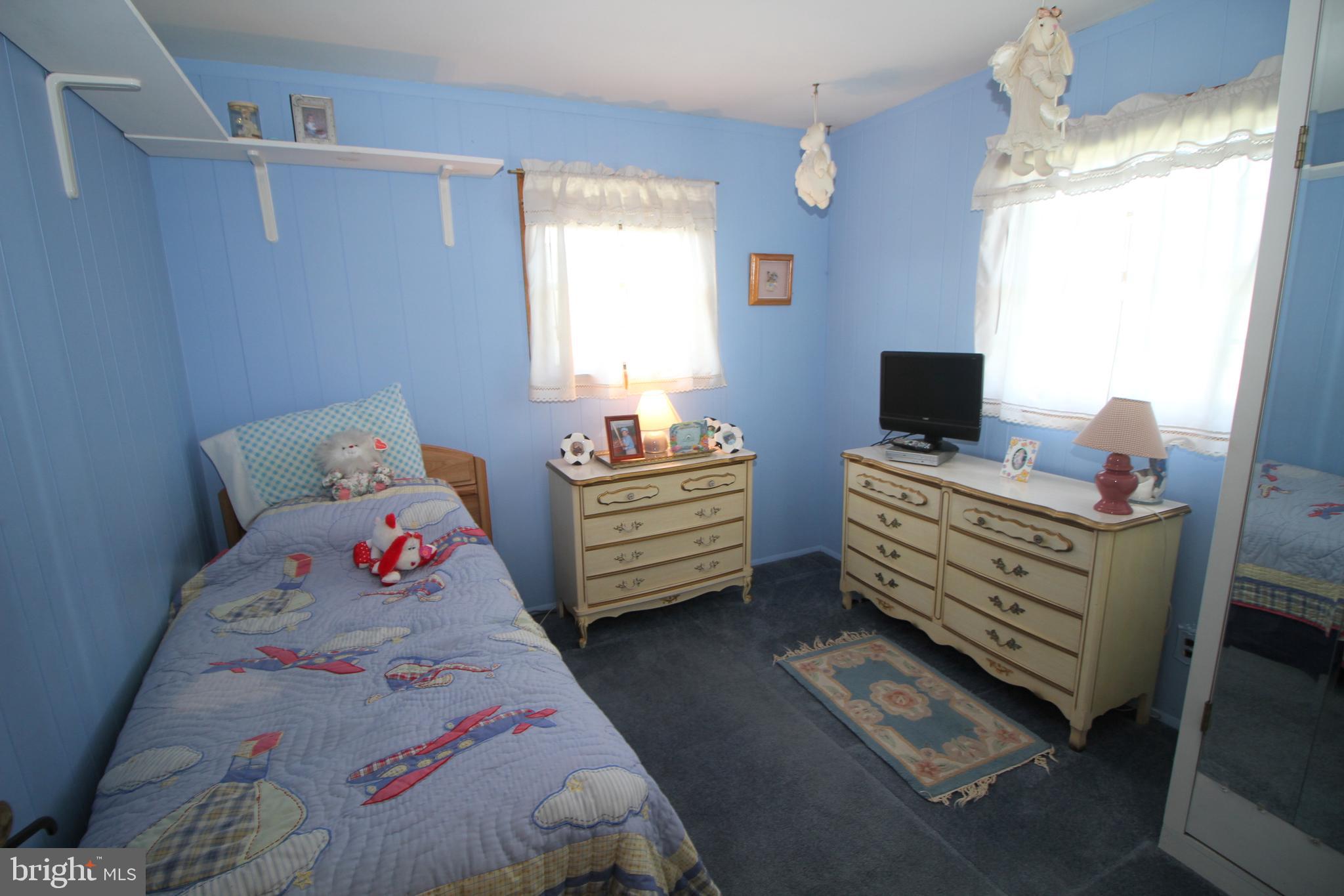 6 Claude Road Hamilton, NJ 08620 - Photo 18 of 29 a bedroom with a bed and flat screen tv