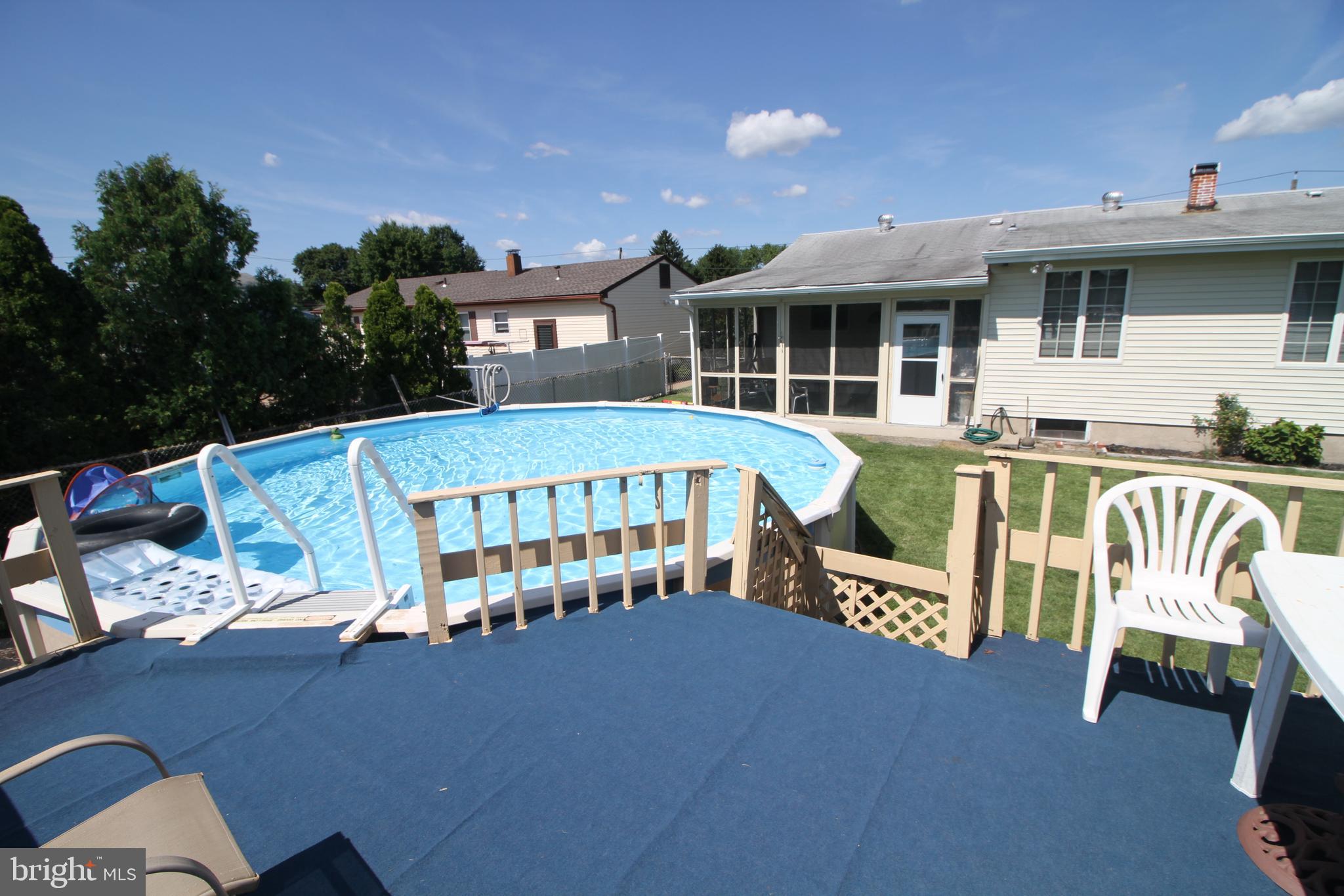 6 Claude Road Hamilton, NJ 08620 - Photo 27 of 29 a view of a patio with table and chairs with wooden floor and fence
