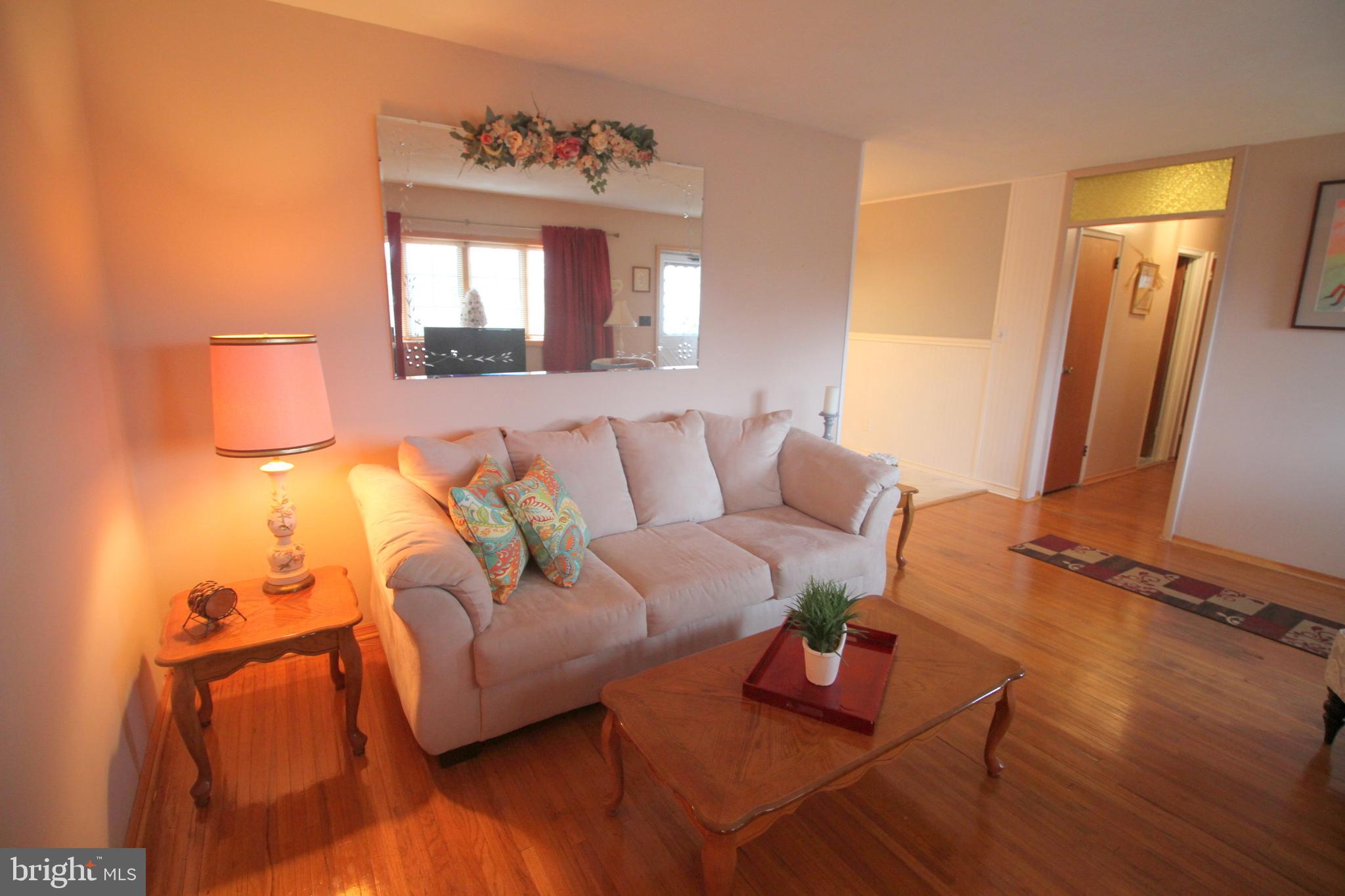 6 Claude Road Hamilton, NJ 08620 - Photo 4 of 29 a living room with furniture and a mirror