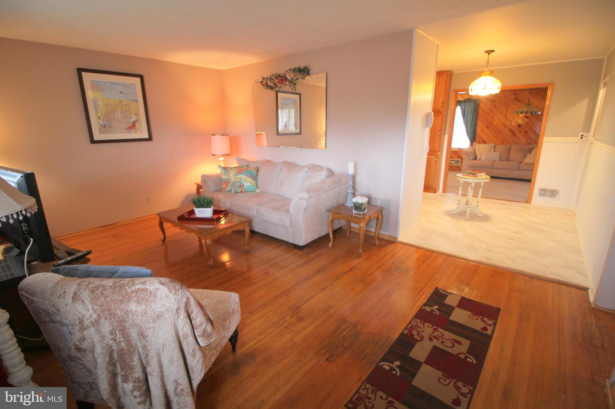 6 Claude Road Hamilton, NJ 08620 - Photo 5 of 29 a living room with furniture and a flat screen tv