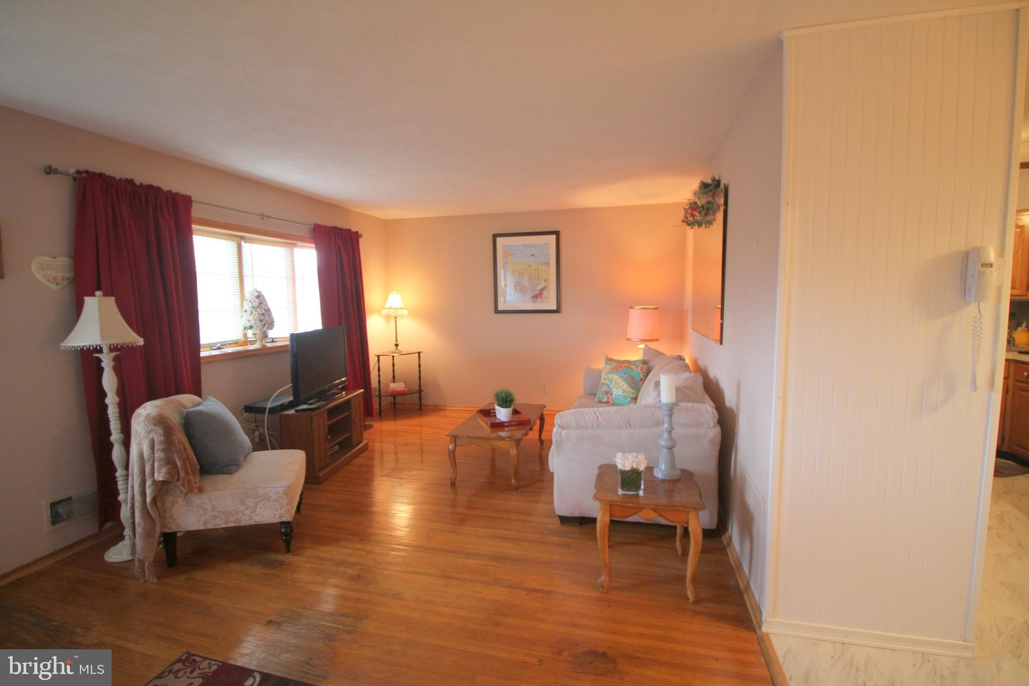 6 Claude Road Hamilton, NJ 08620 - Photo 6 of 29 a living room with furniture and a wooden floor
