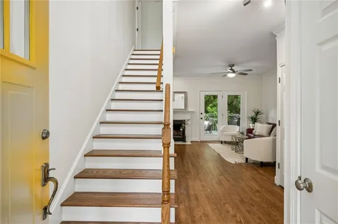 a view of entryway and hall with wooden floor