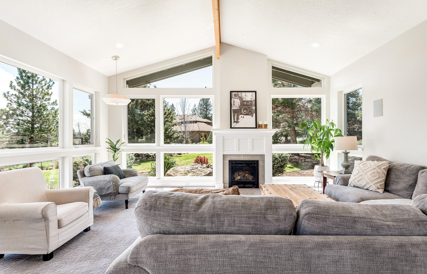61510 Southwest Longview Street Bend, OR 97702 - Photo 15 of 43 a living room with furniture a large window and a fireplace