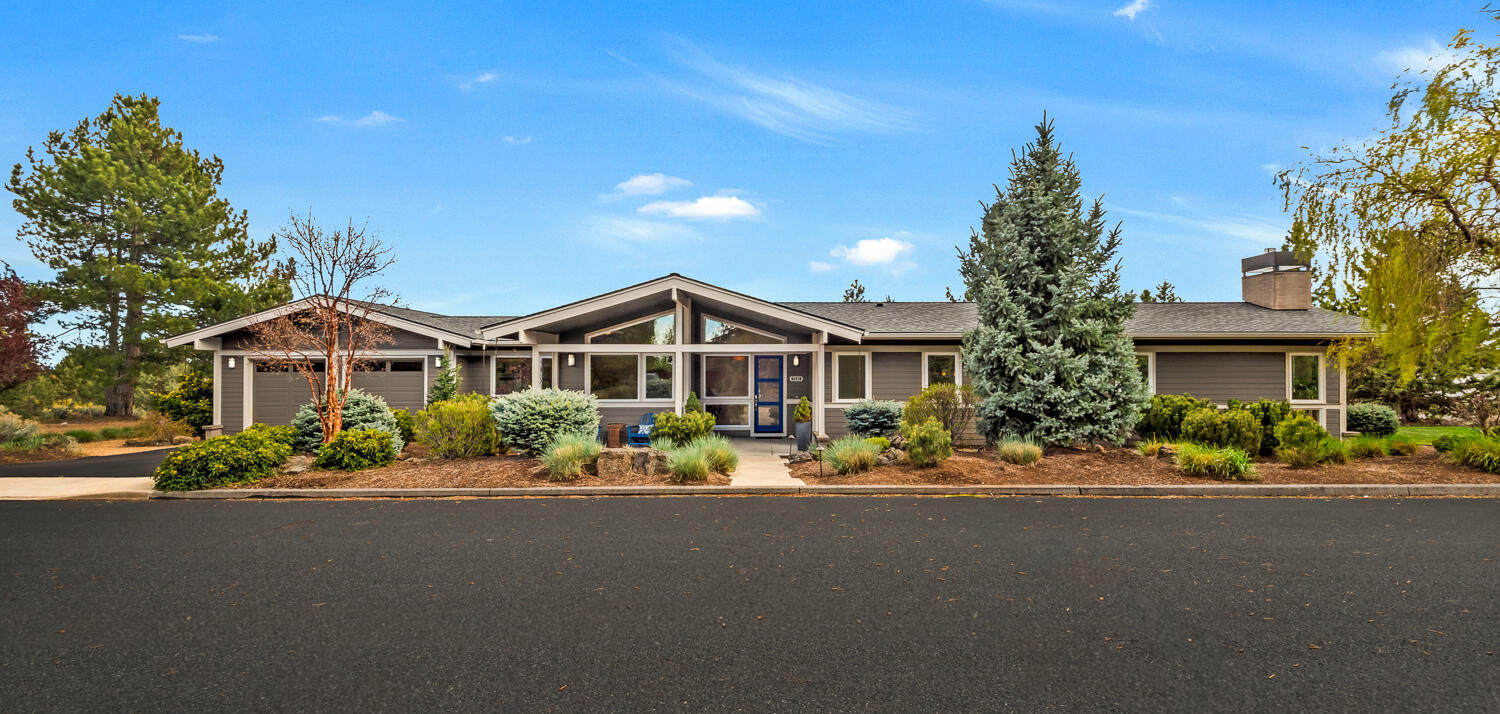 61510 Southwest Longview Street Bend, OR 97702 - Photo 2 of 43 a front view of a house with a yard