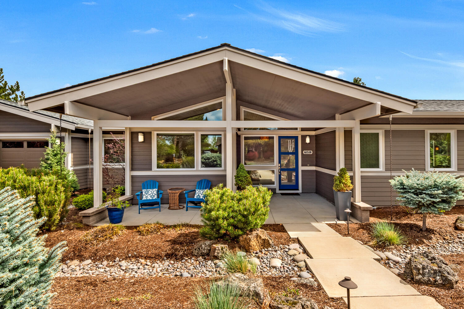 61510 Southwest Longview Street Bend, OR 97702 - Photo 4 of 43 a view of a house with lounge chair and potted plants