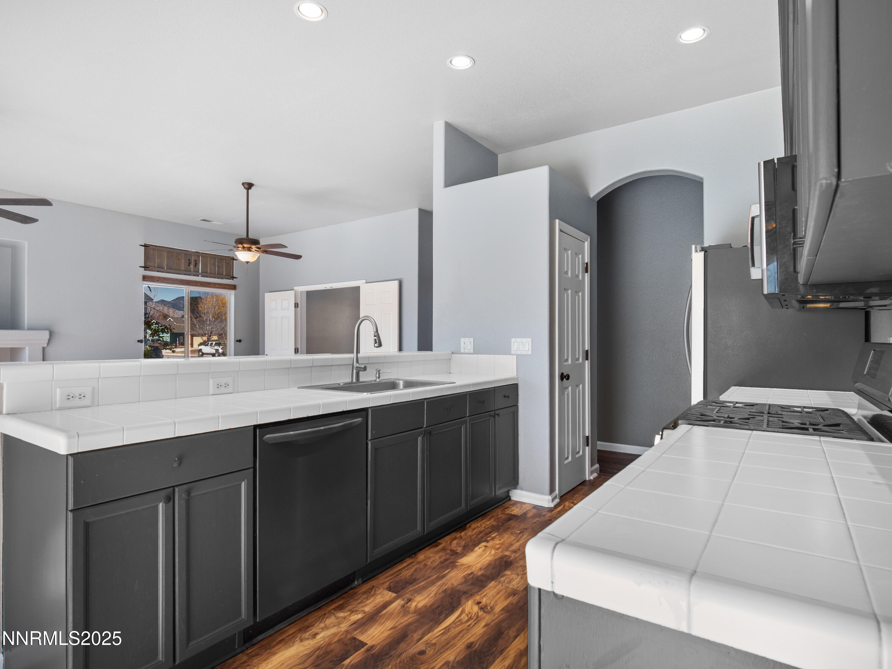 117 Elk Horn Drive Dayton, NV 89403 - Photo 12 of 59 a spacious bathroom with a sink and a large mirror