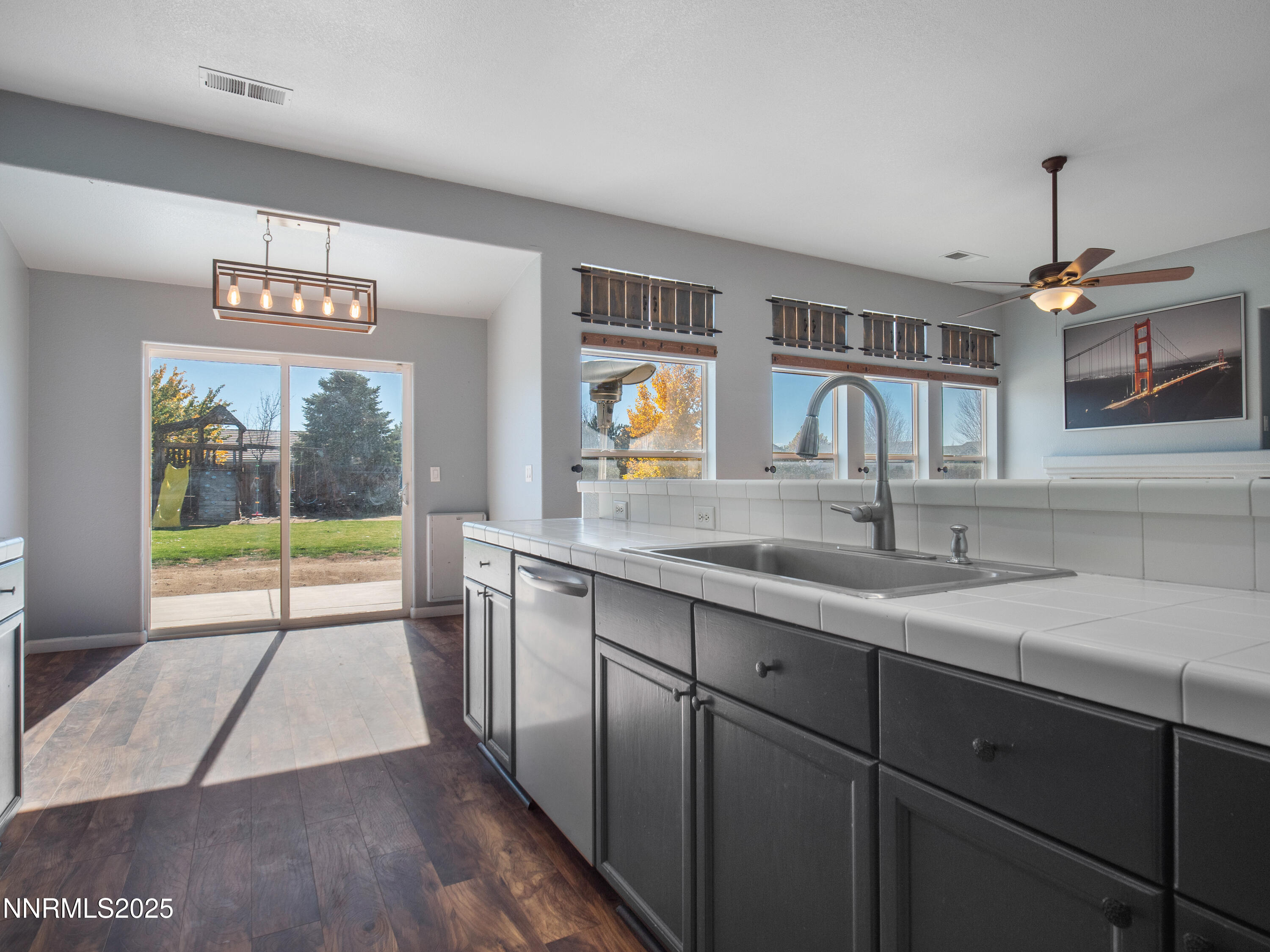117 Elk Horn Drive Dayton, NV 89403 - Photo 13 of 59 a view of a kitchen with a sink and wooden floor