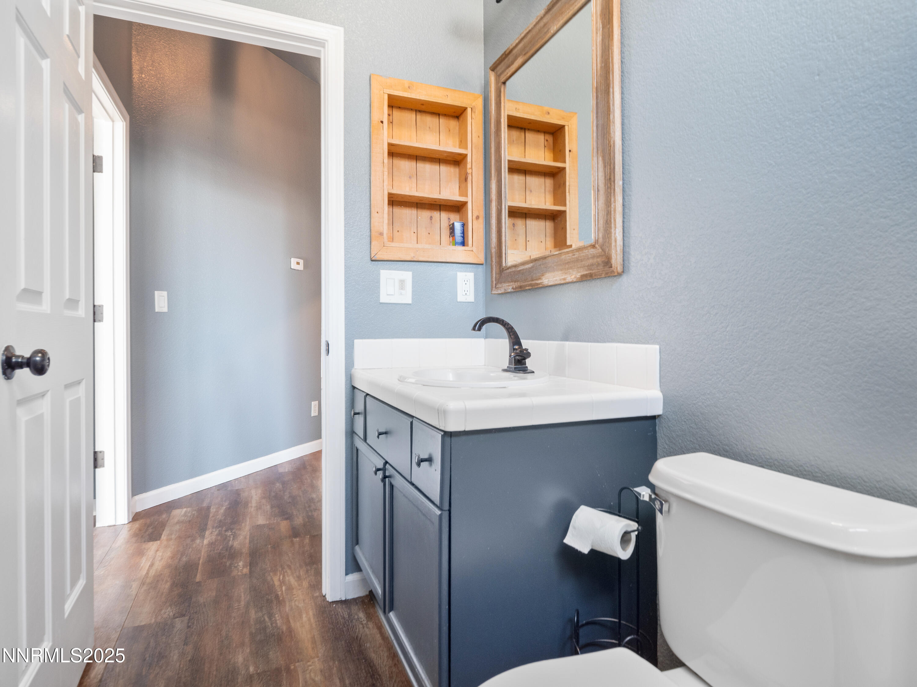 117 Elk Horn Drive Dayton, NV 89403 - Photo 20 of 59 a bathroom with a sink toilet and vanity