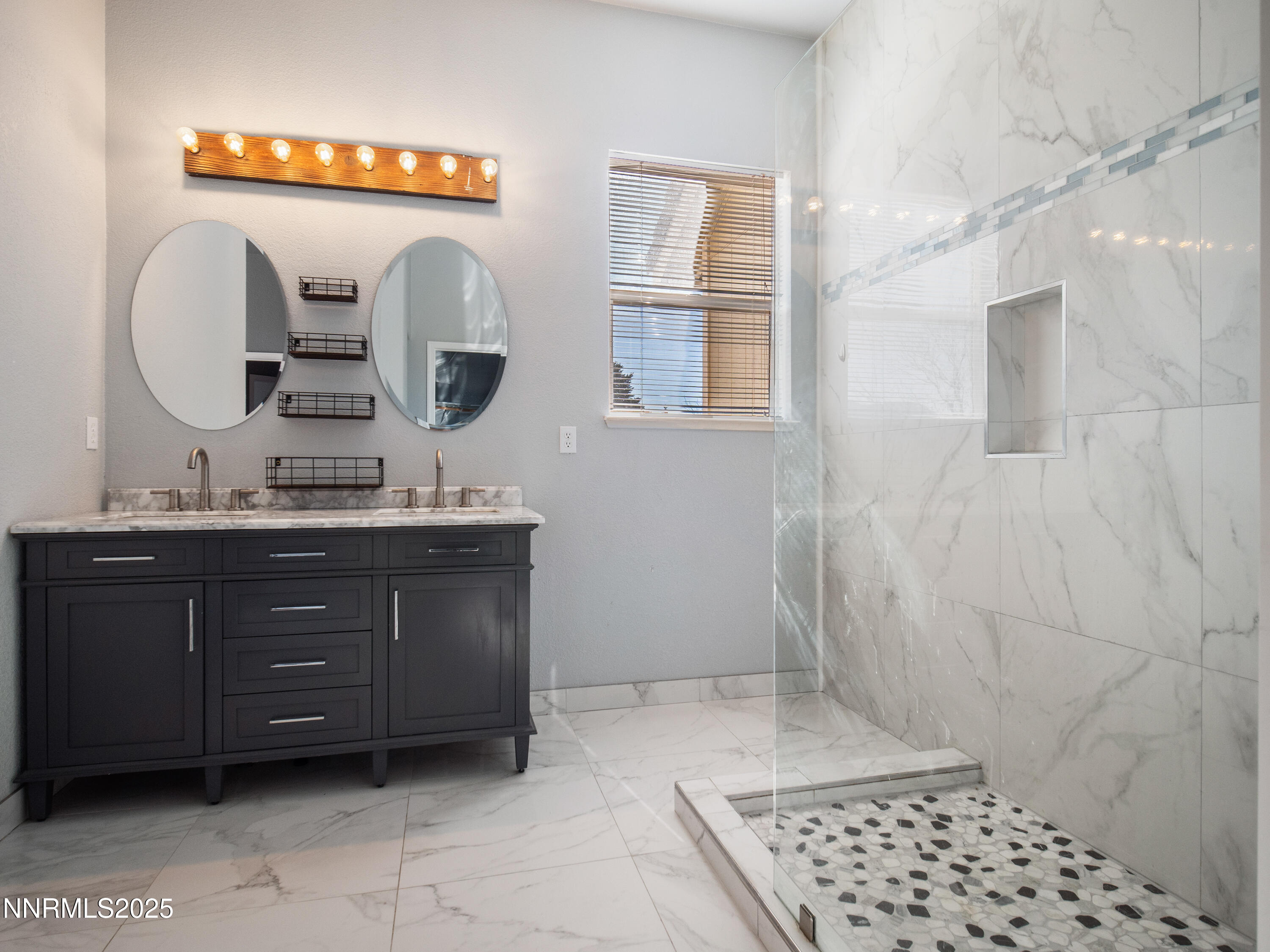 117 Elk Horn Drive Dayton, NV 89403 - Photo 28 of 59 a bathroom with a granite countertop sink a mirror and shower