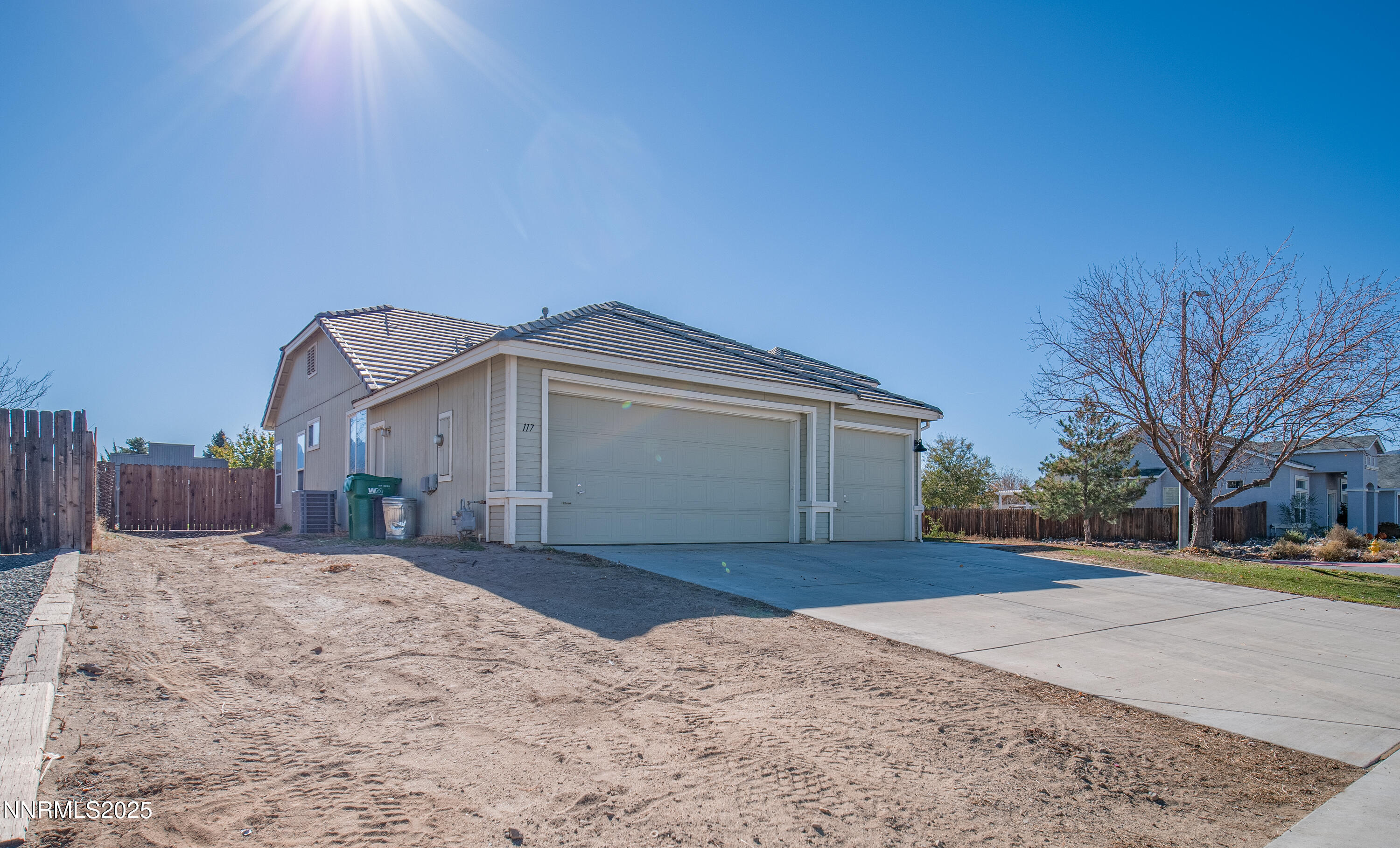 117 Elk Horn Drive Dayton, NV 89403 - Photo 3 of 59 a front view of a house with a yard and garage